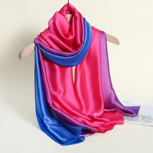 Detailed close-up showing smooth satin texture and rose red to royal blue gradient scarf