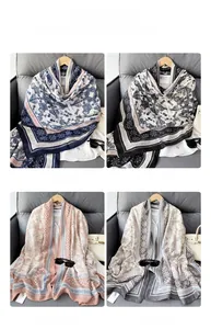 Detail of bohemian cotton-linen scarves in blue, black, pink, and grey geometric patterns