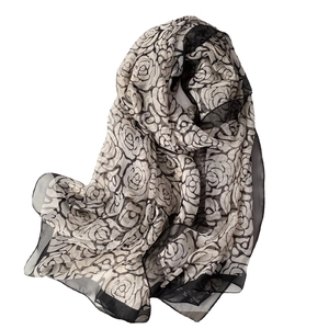 Elegant lightweight camellia print scarf in black and white sheer breathable fabric