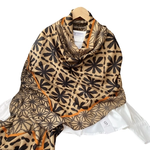 Chic beige cotton linen feeling scarf with orange border and black floral print