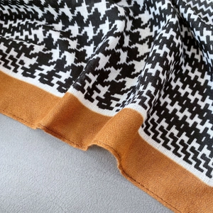 Retro houndstooth cotton linen scarf in black and white with orange border detail