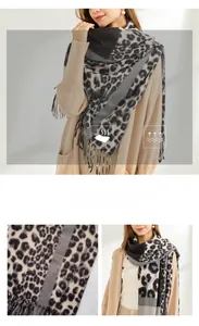 Detail view of leopard print cashmere scarf showing soft texture and fringe edges