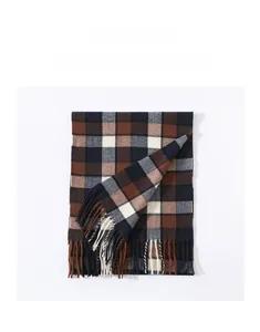 Detailed view of classic plaid scarf with earth-tone checkered pattern and soft tassels