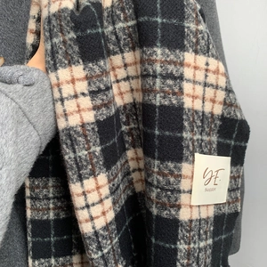 Thick plaid winter scarf for women in black and beige with soft cashmere texture