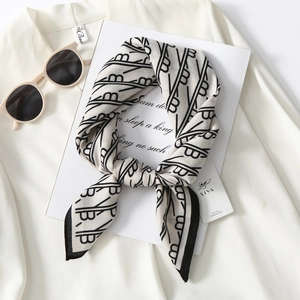 Elegant geometric print silk scarf in cream white with black patterns for women