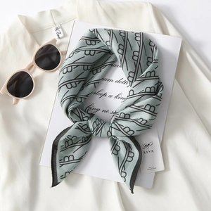 Blue-grey silk scarf with B-pattern texture and black border on white background