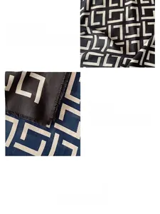 Detail of geometric pattern on lightweight spring scarf with delicate fringe edges