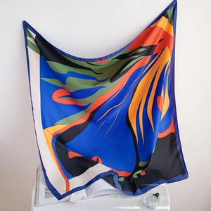 Fashionable twill silk square scarf featuring vibrant abstract patterns and bold colors