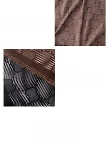 Detail of vintage monogram scarf with fringe edges and premium fabric texture