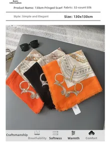 Detail view of orange square scarf with chain pattern and frayed fringe edges