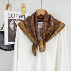 Brown cotton-linen square scarf with vintage geometric patterns tied on a white shirt