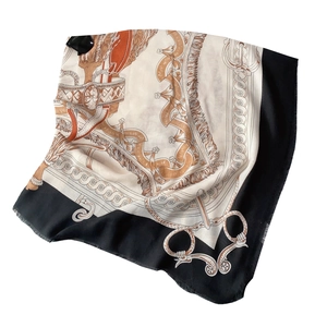 Orange and black silk scarf with equestrian horse carriage pattern and fringe detail