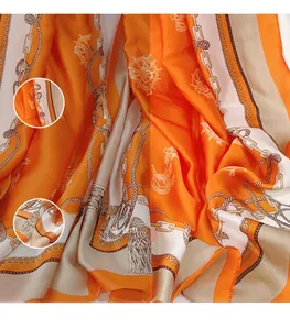 Detail view of nautical themed silk scarf showing high-quality print and smooth satin texture