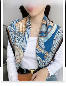 Detailed close-up of blue French castle silk scarf with hot air balloon pattern