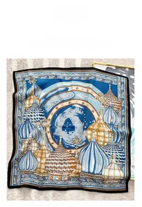 Detailed pattern of a French style square silk scarf featuring blue castle architecture