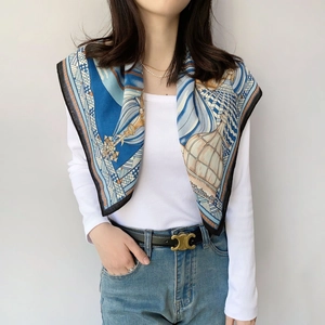 Detail of blue French style silk scarf with vintage nautical print and elegant black borders