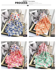 Detail showing colorful daisy floral patterns on soft satin scarves in four colors