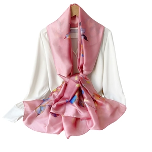 Elegant floral chiffon silk scarf in light pink with leaf pattern on white shirt