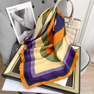 Silk-like satin square scarf with colorful geometric stripes and English script print