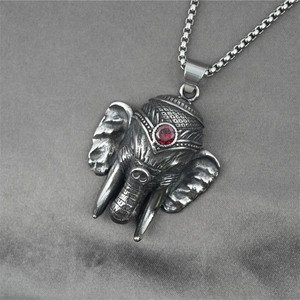 Vintage titanium steel elephant pendant with red gemstone on grey velvet necklace