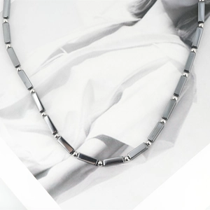 Unisex titanium steel necklace with dark grey hematite beads and silver metallic accents