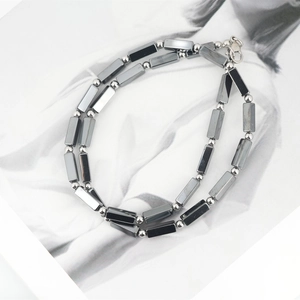 Minimalist titanium steel necklace with grey rectangular beads and silver round accents