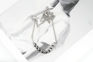 Detail shot of silver Cuban link stainless steel necklace with textured chunky chain