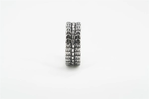 Close-up of vintage titanium steel dragon scale texture ring with antique silver finish