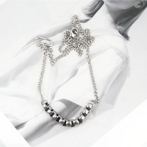 Minimalist silver stainless steel Cuban link necklace with seven cylindrical charms