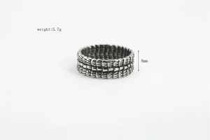 Macro detail of silver dragon scale ring showing 8mm width and 5.7g weight