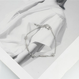 Minimalist daisy flower charm bracelet in silver titanium steel with adjustable lobster clasp