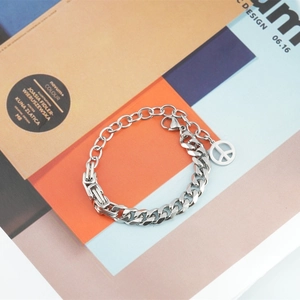 Fashionable stainless steel Cuban link bracelet with a peace sign charm and lobster clasp