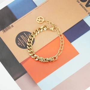 Gold Cuban chain bracelet with rectangular links and peace sign pendant for women