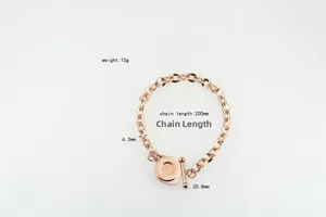 Close-up of rose gold OT buckle bracelet with engraved Proverbs 4:23 coin charm