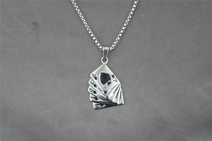 Detailed macro view of hip hop playing cards pendant with spade A K Q J steel charms
