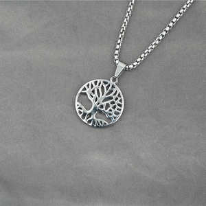 Silver Tree of Life hollow round pendant necklace with thick box chain on grey background