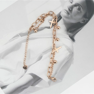 Double-layered rose gold titanium bracelet with cross charms and polished beads