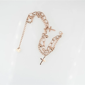 Rose gold layered titanium steel bracelet with cross charms and metallic beads