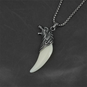 Retro wolf head tooth pendant necklace for men in titanium steel on dark fabric
