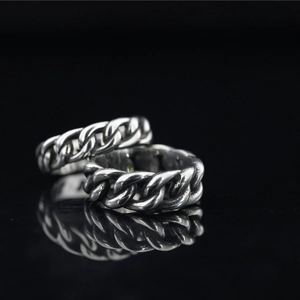 Vintage Cuban link chain rings in brushed stainless steel with industrial woven design