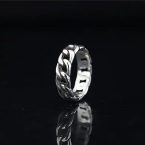 Cuban link chain ring in silver stainless steel with vintage oxidation on black reflection