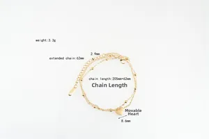 Double-layer gold titanium steel bracelet featuring a movable heart pendant and small beads