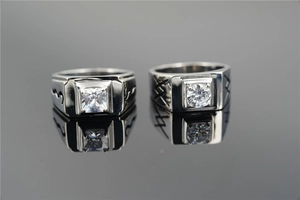 Macro shot of square and round cut zircon rings with polished stainless steel finish