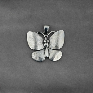 Retro butterfly pendant in silver stainless steel with a fine brushed texture finish