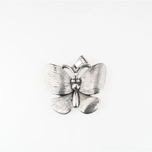 Vintage titanium steel butterfly pendant with textured wings and antique silver finish