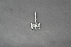 Macro view of silver Viking labrys pendant with Celtic knot and cross patterns