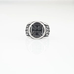 Gothic style stainless steel ring featuring a black iron cross and relief side patterns