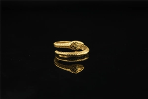 Detailed view of vintage gold snake ring showing intricate scales and wrap-around design