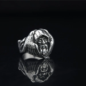 Retro stainless steel ring featuring a detailed Nordic Odin or wizard sculpture relief