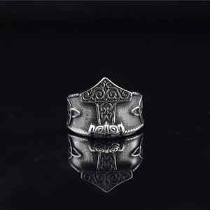 Vintage Viking Mjolnir ring in oxidized titanium steel with intricate Celtic patterns